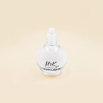 Shine Liquid en rolón, toque de brillo instantáneo para rostro y cuerpo.